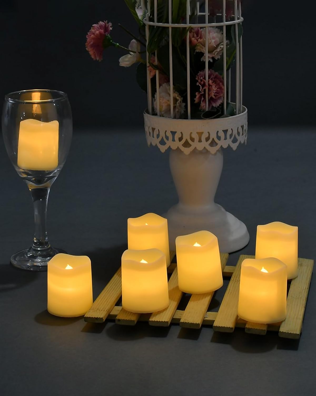 SHYMERY Realistic Flickering LED Tea Light Candles 24 Pack for Wedding Reception Decorations 200 Hour Battery Warm White